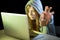 Young attractive teen woman wearing hoodie hacking laptop cybercrime cyber crime concept