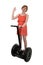 Young attractive tourist woman in chic summer dress smiling happy riding electrical segway