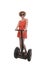 Young attractive tourist woman in chic summer dress smiling happy riding electrical segway