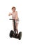 Young attractive tourist woman in summer shorts smiling happy riding electrical segway