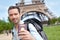 Young attractive traveler in Paris with passport