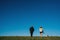 Young attractive walking with a dog in the park Oamaru, New Zealand