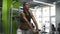 Young attractive woman doing kettlebell exercise during a crossfit workout at the gym. Girl with fitness body training