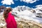 Young attractive woman enjoying the stunning view of Morteratsch glacier from Diavolezza mountain, canton G