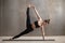 Young attractive woman in Full Version of Vasisthasana pose, stu