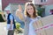 Young attractive woman happy to receive parcel