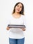 Young attractive woman holding empty pizza tray on white background. Copy space and mock up. Blank template background