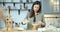 Young attractive woman mixing milk and eggs cooking omelet or pancake dough in the kitchen