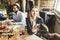 Young attractive woman paying in cafe with contactless smartphone payment