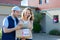 Young attractive woman phoning during a delivery