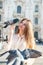 Young attractive woman posing with pigeon near Milan Cathedral, Italy