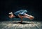 Young attractive woman practicing yoga doing side crane pose in dark room