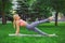 Young attractive woman practicing yoga outdoors