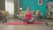 A young attractive woman sits in a lotus position, takes a slow breath in and out. Portrait of redhead woman practicing