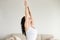 Young attractive woman in Tadasana pose, at living room, closeup