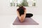 Young attractive yogi woman practicing yoga concept, sitting