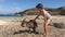 Young australian girl plays with kangaroos in Lucky Bay Western Australia
