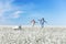 Young aviators with an airplane in the field