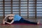 Young awesome happy woman developing flexibility. full length photo.yoga practise