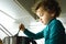 Young baby girl helps prepare a cake using a food processor