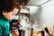 Young baby girl helps prepare a cake using a food processor