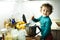 Young baby girl helps prepare a cake using a food processor