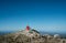 Young backpacker man with trekking poles climbing Sinjal or Dinara 1831 m mountain - the highest of Croatia in the Dinaric Alps on