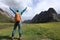 Young backpacking woman hiking in mountains