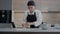 Young Baker Girl Prepares Dough With Flour.