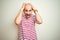 Young bald man with beard wearing casual striped red t-shirt over white isolated background Crazy and scared with hands on head,