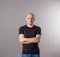 young bald man in black t-shirt studio shot