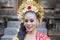 Young balinese dancer smiling in the temple