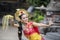 Young balinese pendet dancer dancing in temple