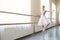 Young ballerina getting ready for dancing at performance