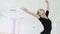 Young ballerina makes beautiful movements with her hands.