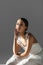 Young ballerina smiling at camera on