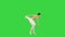 Young ballerina walks demi-pointe raising arms on a Green Screen, Chroma Key.