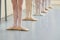 Young ballerinas legs in basic position.