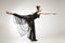 Young ballet dancer wearing black transparent dress dancing