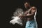 Young bare-chested african american sportsman applying talcum powder