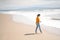 Young barefoot girl on the beach