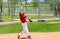 Young baseball player swinging bat