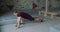 Young bearded athlete warming up before training on a climbing wall