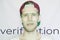 Young bearded hipster in a snapback cap biometric face scan isolated