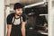 Young Bearded Man in Apron Standing in Food Truck.