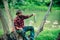 Young bearded man fishing at a lake or river. Flyfishing.