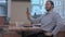 Young bearded man taking a selfie in coffee shop