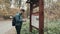 Young Bearded Man Walking In Autumn Forest With a Touristic Backpack, Autumn Style, Travelling Lifestyle