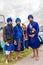 Young bearded warriors of the Sikh monotheism religion in procession with a hawk