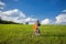 Young beatiful girl in green field